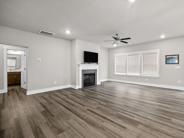 1116 Denington Dr, Spartanburg, SC 29307 - unfurnished living room with a ceiling fan, dark wood-type flooring, a fireplace, and recessed lighting