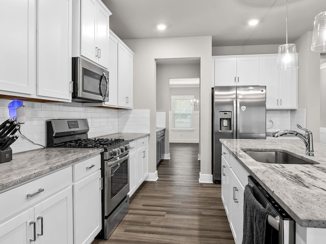 1116 Denington Dr, Spartanburg, SC 29307 - kitchen featuring appliances with stainless steel finishes, white cabinets, dark wood finished floors, backsplash, and recessed lighting