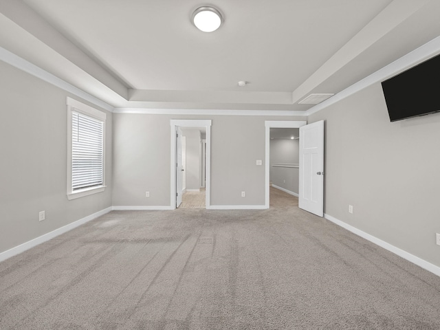 1116 Denington Dr, Spartanburg, SC 29307 - unfurnished bedroom featuring a raised ceiling, a spacious closet, and carpet flooring