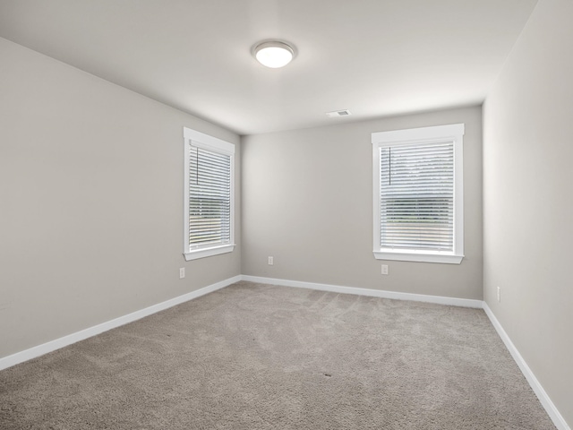 1116 Denington Dr, Spartanburg, SC 29307 - spare room featuring light colored carpet and baseboards