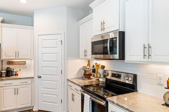 222 Eventine Way, Boiling Springs, SC 29316 - kitchen with appliances with stainless steel finishes, backsplash, white cabinets, light stone counters, and recessed lighting