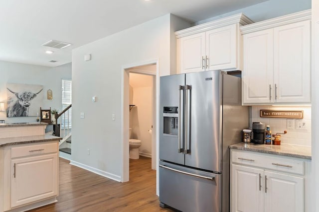 222 Eventine Way, Boiling Springs, SC 29316 - kitchen featuring high end fridge, tasteful backsplash, wood finished floors, white cabinets, and recessed lighting