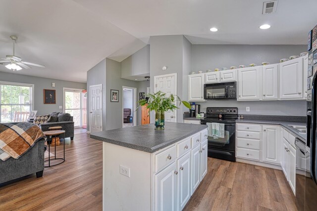 286 Heatherbrook Dr, Lyman, SC 29365 - kitchen with black appliances, vaulted ceiling, dark countertops, a ceiling fan, and open floor plan