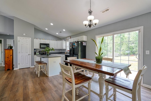 286 Heatherbrook Dr, Lyman, SC 29365 - dining area featuring lofted ceiling, wood finished floors, recessed lighting, and a chandelier