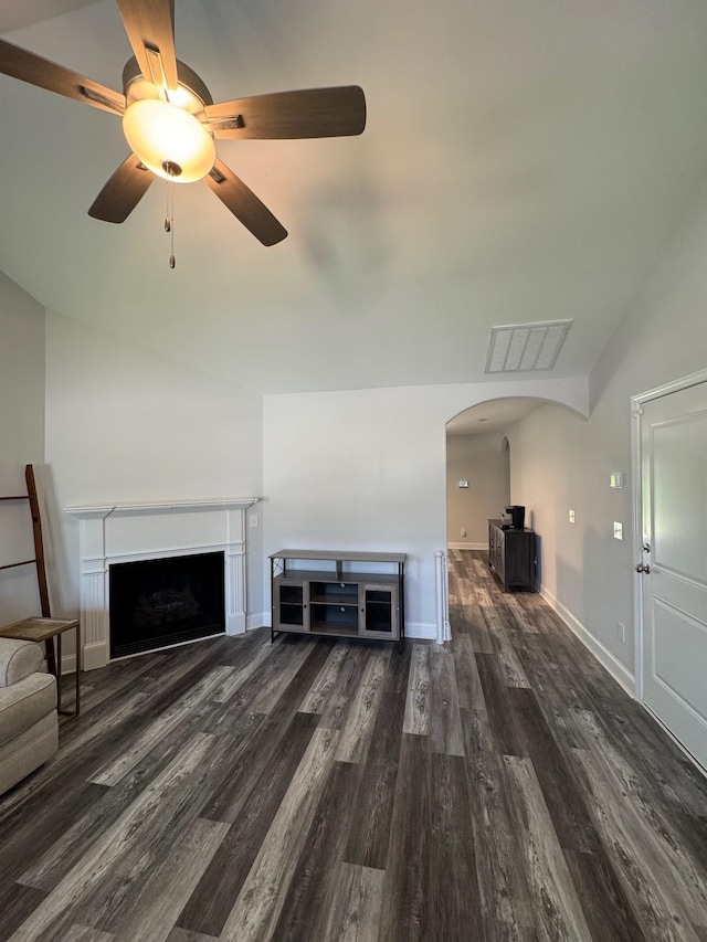 711 Burbrook Ln, Boiling Springs, SC 29316 - unfurnished living room with arched walkways, wood finished floors, vaulted ceiling, a fireplace, and a ceiling fan