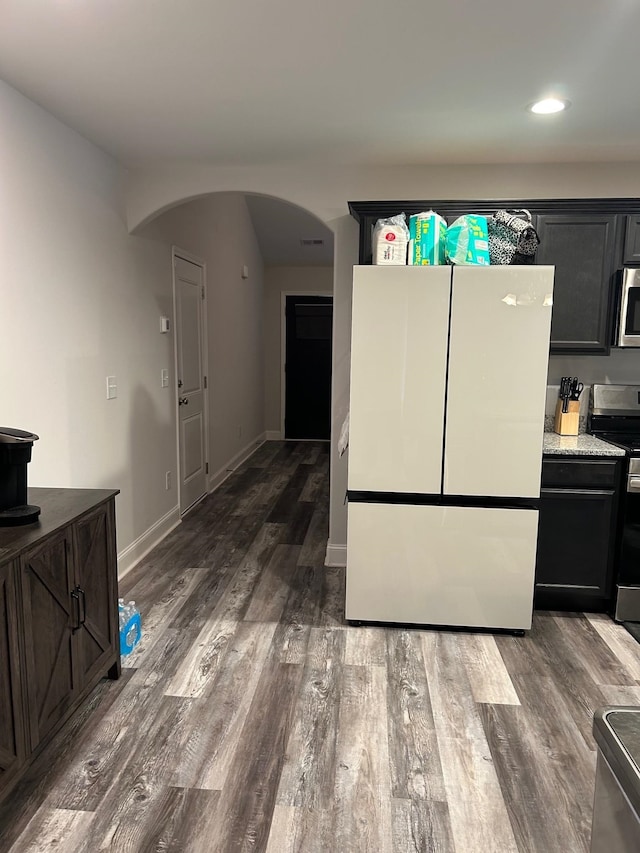 711 Burbrook Ln, Boiling Springs, SC 29316 - kitchen featuring stainless steel appliances, arched walkways, dark wood-style floors, and recessed lighting