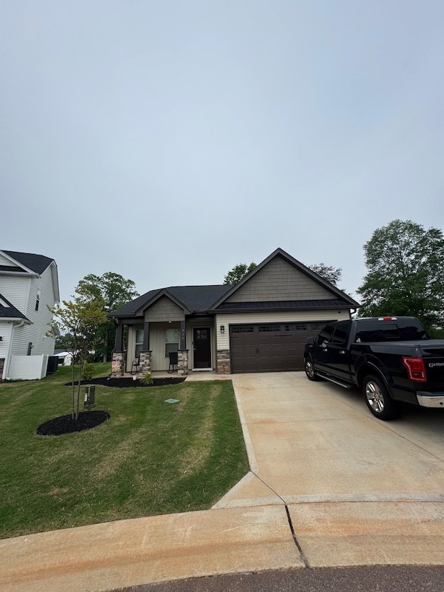 711 Burbrook Ln, Boiling Springs, SC 29316 - view of front of property featuring a garage, driveway, a front lawn, and stone siding