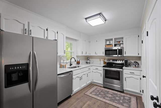 15864 Asheville Hwy, Campobello, SC 29322 - kitchen featuring appliances with stainless steel finishes, white cabinetry, wood finished floors, open shelves, and ornamental molding