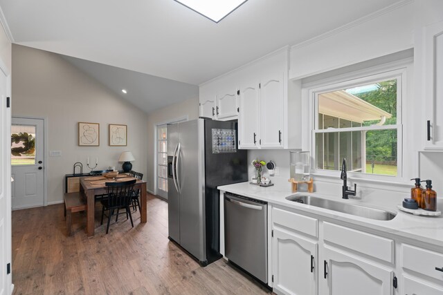 15864 Asheville Hwy, Campobello, SC 29322 - kitchen with stainless steel appliances, lofted ceiling, white cabinetry, light wood finished floors, and recessed lighting
