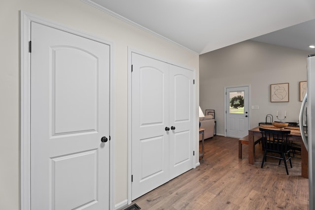 15864 Asheville Hwy, Campobello, SC 29322 - hallway featuring light wood finished floors, ornamental molding, lofted ceiling, and recessed lighting