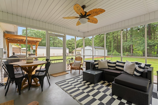 15864 Asheville Hwy, Campobello, SC 29322 - sunroom with a ceiling fan, an outdoor living space, view of scattered trees, and outdoor dining area