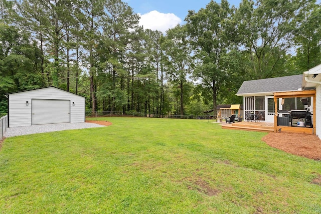 15864 Asheville Hwy, Campobello, SC 29322 - fenced backyard featuring a sunroom, a garage, an outdoor structure, and a wooden deck