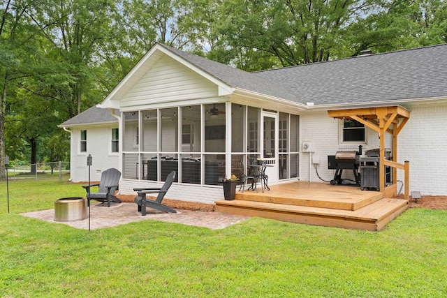 15864 Asheville Hwy, Campobello, SC 29322 - rear view of house featuring a sunroom, a wooden deck, roof with shingles, and brick siding
