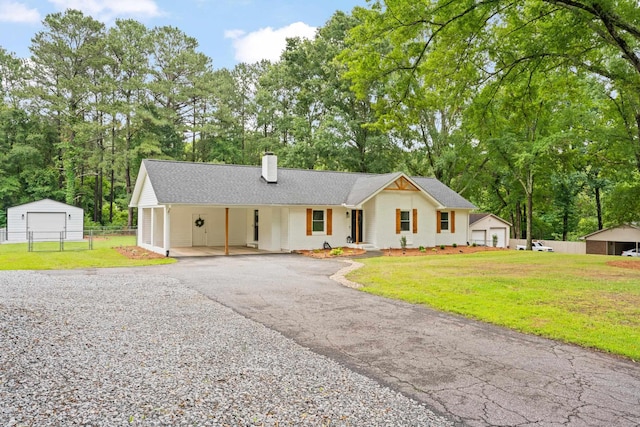 15864 Asheville Hwy, Campobello, SC 29322 - view of front of property featuring a chimney, driveway, an outbuilding, view of wooded area, and a shingled roof