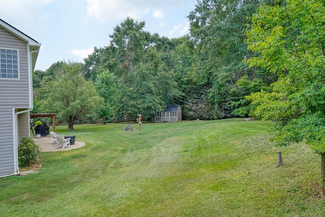 316 Crestview Ln, Spartanburg, SC 29301 - view of grassy yard with a patio area and a storage shed