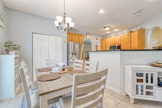 316 Crestview Ln, Spartanburg, SC 29301 - dining area featuring arched walkways, a chandelier, light tile patterned floors, a textured ceiling, and recessed lighting