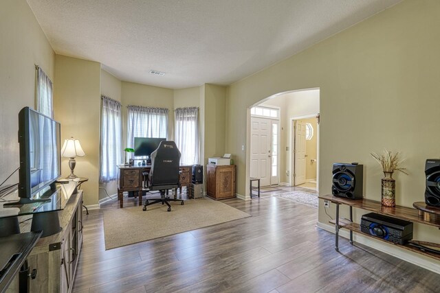 316 Crestview Ln, Spartanburg, SC 29301 - office featuring arched walkways, dark wood-style floors, and a textured ceiling