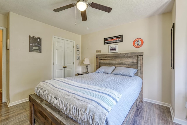 316 Crestview Ln, Spartanburg, SC 29301 - bedroom with wood finished floors, a closet, a ceiling fan, and a textured ceiling