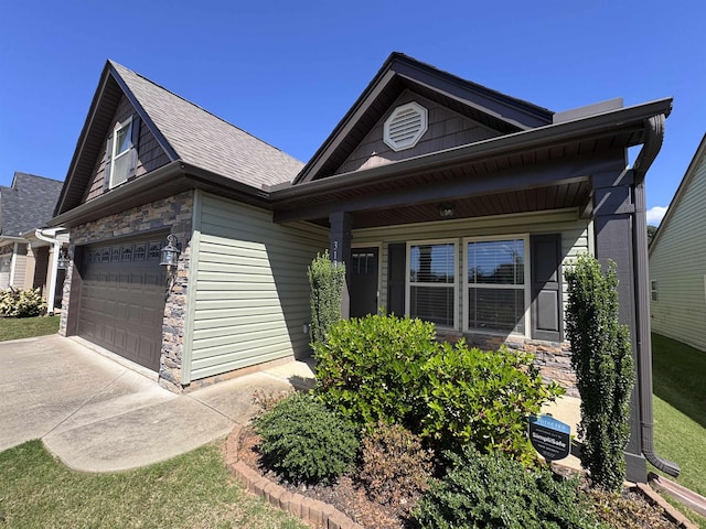 313 Trail Crossing Ln, Inmann, SC 29349 - view of front of house with stone siding, driveway, and a shingled roof