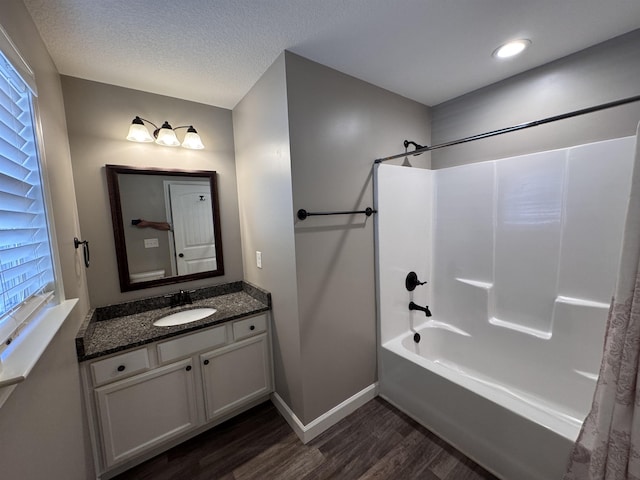313 Trail Crossing Ln, Inmann, SC 29349 - bathroom with wood finished floors, shower / tub combination, vanity, and a textured ceiling
