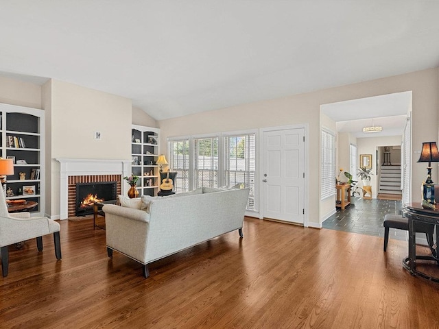 135 N Fairview Ave, Spartanburg, SC 29302 - living area featuring wood finished floors, a fireplace, and built in features