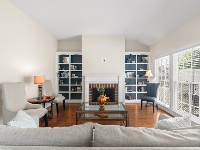 135 N Fairview Ave, Spartanburg, SC 29302 - living area featuring lofted ceiling, wood finished floors, and a brick fireplace