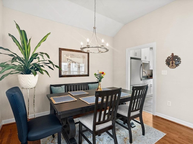 135 N Fairview Ave, Spartanburg, SC 29302 - dining space with a chandelier, lofted ceiling, and wood finished floors