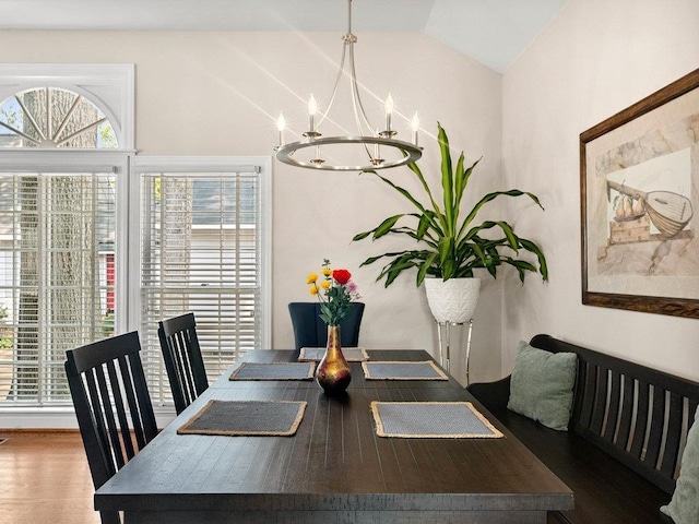 135 N Fairview Ave, Spartanburg, SC 29302 - dining area featuring a chandelier, vaulted ceiling, and wood finished floors