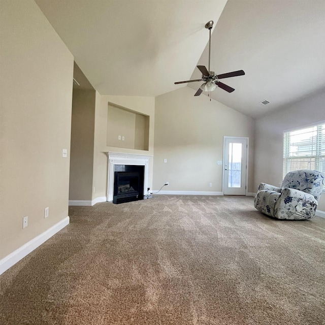 240 Stonecrest Dr, Roebuck, SC 29376 - unfurnished living room with ceiling fan, carpet, high vaulted ceiling, and a fireplace with flush hearth