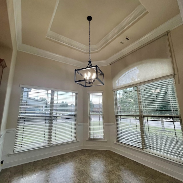 240 Stonecrest Dr, Roebuck, SC 29376 - unfurnished dining area featuring a chandelier, a raised ceiling, a wainscoted wall, crown molding, and tile patterned floors
