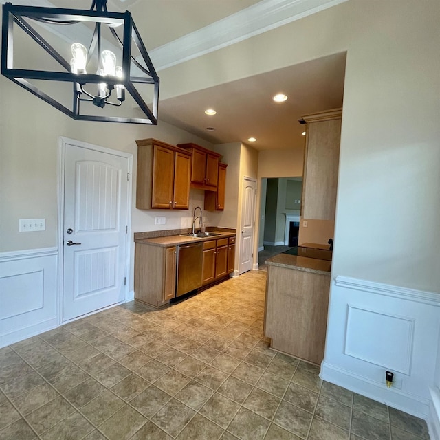 240 Stonecrest Dr, Roebuck, SC 29376 - kitchen featuring stainless steel dishwasher, crown molding, a chandelier, brown cabinets, and wainscoting