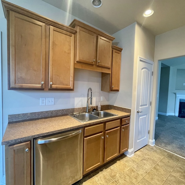 240 Stonecrest Dr, Roebuck, SC 29376 - kitchen with dishwasher, light carpet, brown cabinets, recessed lighting, and a fireplace