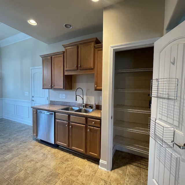 240 Stonecrest Dr, Roebuck, SC 29376 - kitchen with stainless steel dishwasher, a wainscoted wall, recessed lighting, a decorative wall, and brown cabinetry