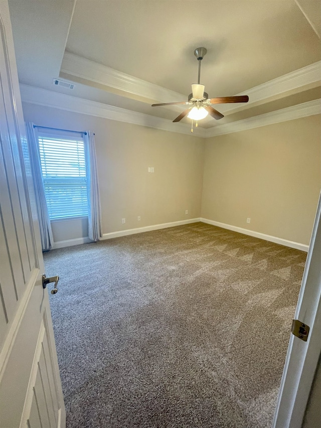 240 Stonecrest Dr, Roebuck, SC 29376 - empty room featuring a tray ceiling, carpet flooring, crown molding, and a ceiling fan