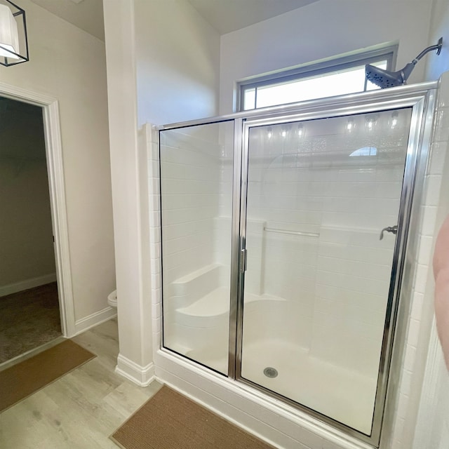 240 Stonecrest Dr, Roebuck, SC 29376 - bathroom featuring a stall shower and wood finished floors