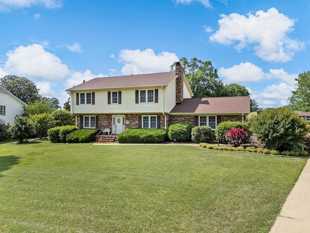 107 Forestdale Dr, Boiling Springs, SC 29316 - colonial home featuring a front lawn, a chimney, and brick siding