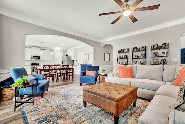 332 Heritage Point Dr, Simpsonville, SC 29681 - living room featuring arched walkways, light wood-style flooring, ornamental molding, ceiling fan, and recessed lighting