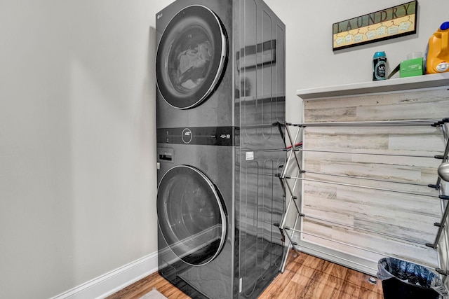 332 Heritage Point Dr, Simpsonville, SC 29681 - laundry room featuring estacked washer and dryer and wood finished floors