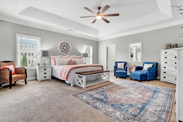 332 Heritage Point Dr, Simpsonville, SC 29681 - carpeted bedroom featuring a tray ceiling, crown molding, and a ceiling fan