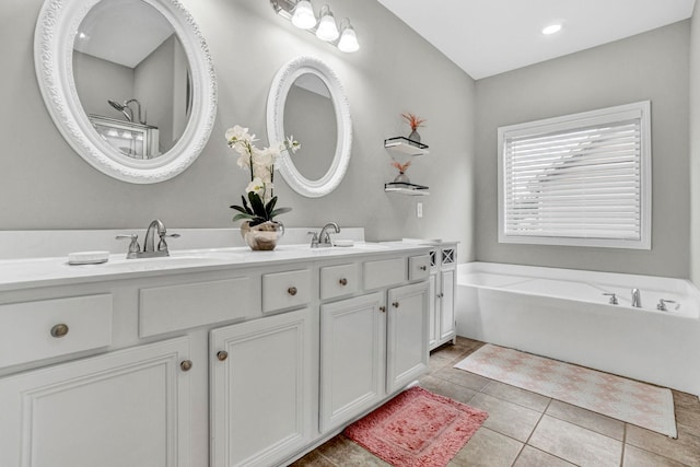 332 Heritage Point Dr, Simpsonville, SC 29681 - bathroom featuring double vanity, a tub to relax in, and tile patterned floors