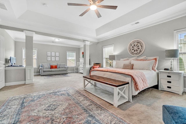 332 Heritage Point Dr, Simpsonville, SC 29681 - bedroom with ornate columns, a tray ceiling, light colored carpet, and crown molding