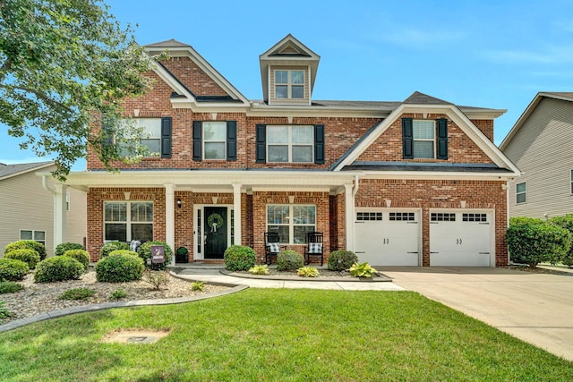 332 Heritage Point Dr, Simpsonville, SC 29681 - craftsman house with brick siding, a garage, a front yard, and concrete driveway