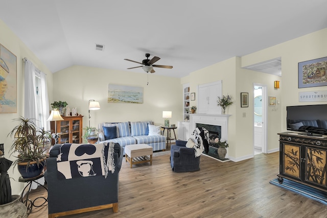 360 W Pointe Dr, Spartanburg, SC 29301 - living area featuring a ceiling fan, wood finished floors, a glass covered fireplace, and vaulted ceiling