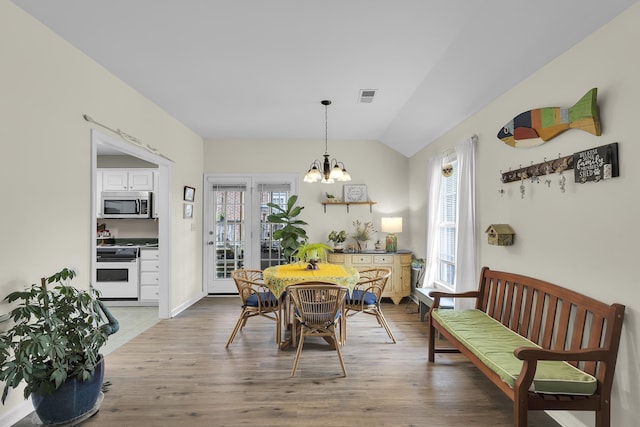 360 W Pointe Dr, Spartanburg, SC 29301 - dining space featuring light wood-type flooring, lofted ceiling, and a chandelier