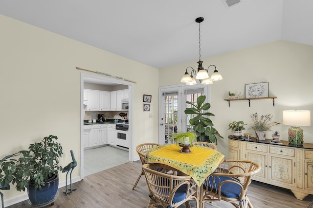 360 W Pointe Dr, Spartanburg, SC 29301 - dining area with a chandelier, light wood-style floors, and lofted ceiling