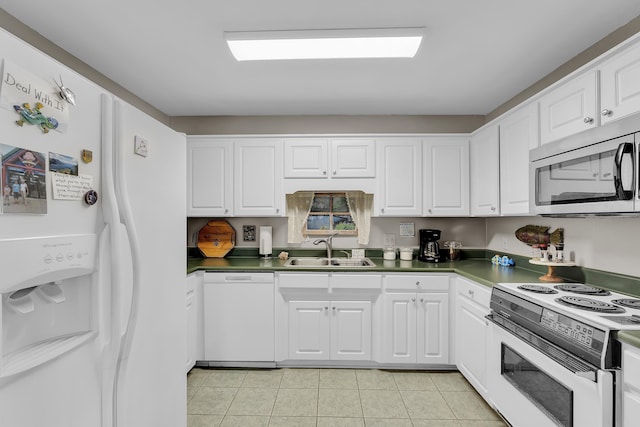 360 W Pointe Dr, Spartanburg, SC 29301 - kitchen with white appliances, white cabinets, light tile patterned floors, and dark countertops