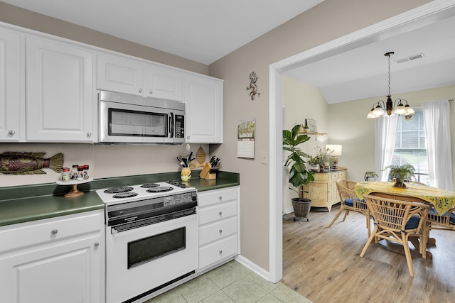 360 W Pointe Dr, Spartanburg, SC 29301 - kitchen with stainless steel microwave, white range with electric stovetop, a chandelier, white cabinets, and dark countertops