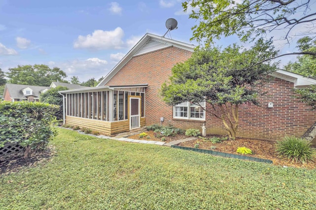 360 W Pointe Dr, Spartanburg, SC 29301 - rear view of property with a sunroom, brick siding, and a lawn
