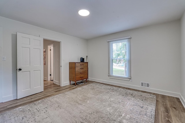236 Heathwood Dr, Spartanburg, SC 29307 - unfurnished bedroom featuring wood finished floors