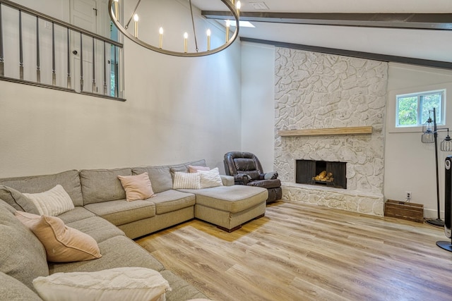 236 Heathwood Dr, Spartanburg, SC 29307 - living area featuring wood finished floors, a chandelier, and a stone fireplace